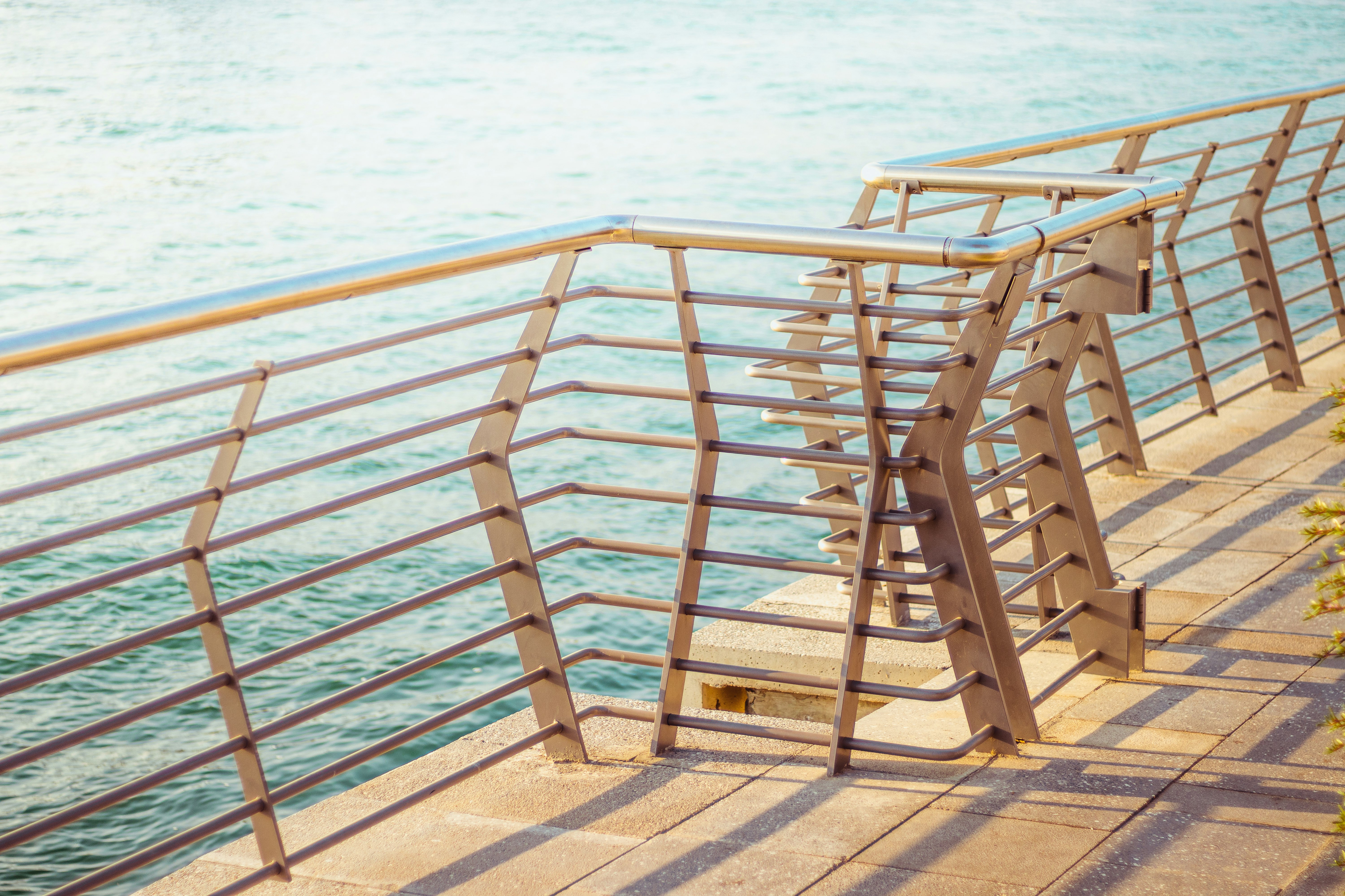 brown wooden stairs on beach during daytime